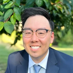 Eric Kim, a dentist at AnaBella Family and Cosmetic Dentistry, smiles for potential patients